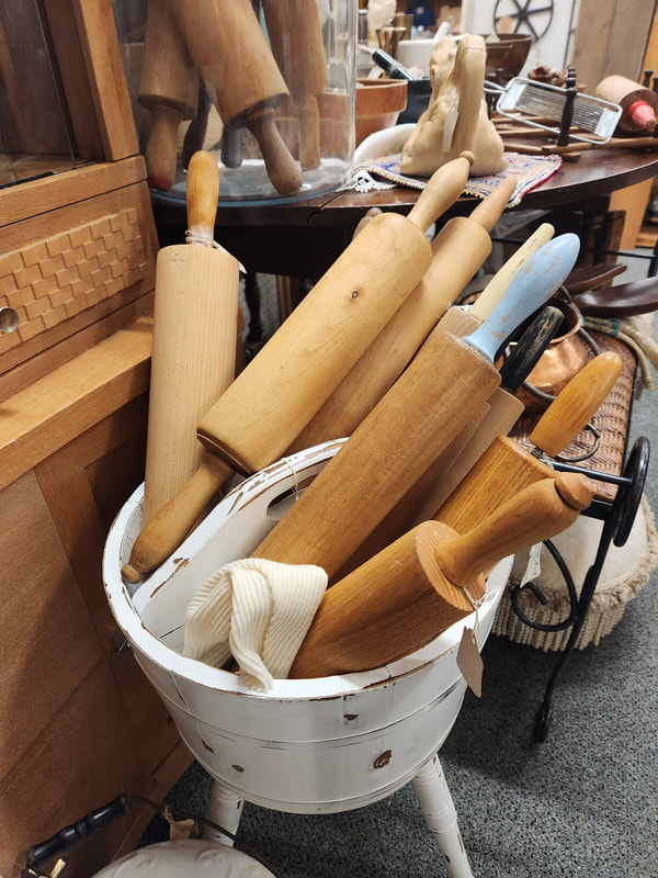 Vintage rolling pins in one of the consignment booths at Apple Annie Antique Gallery