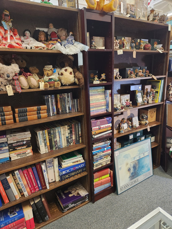 Vintage books and stuffed animals at Apple Annie Antique Gallery