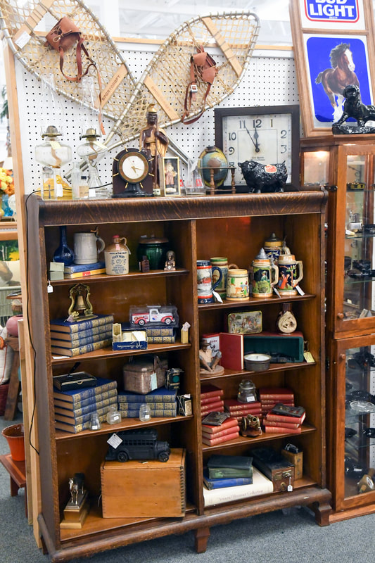 Antique furniture and collectibles from one of the booths in our showroom