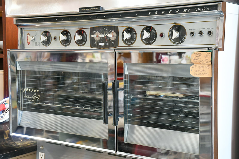 Antique oven and ktichen appliances from one of the booths in our showroom